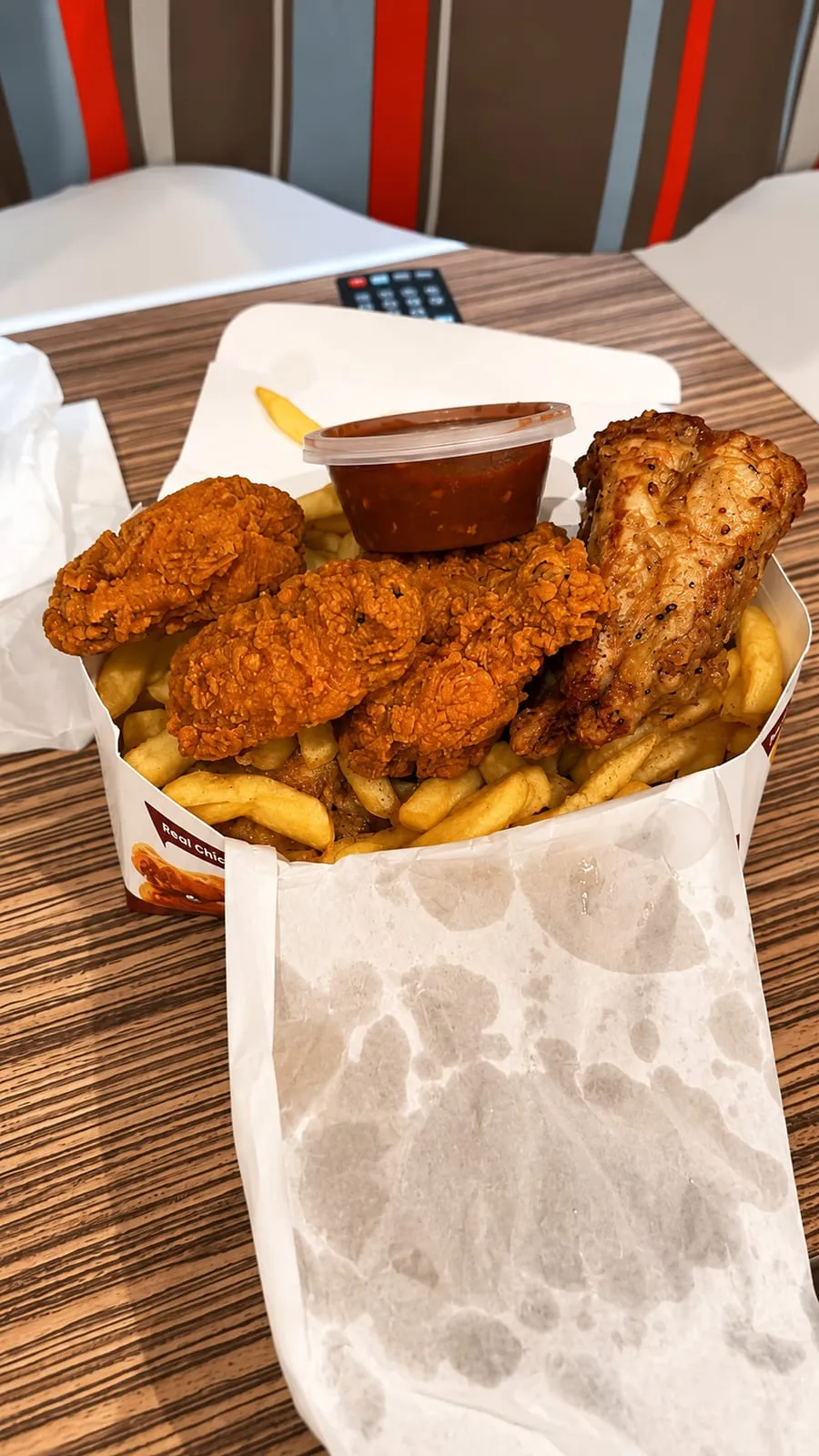 A box of Chick King fried chicken and chips