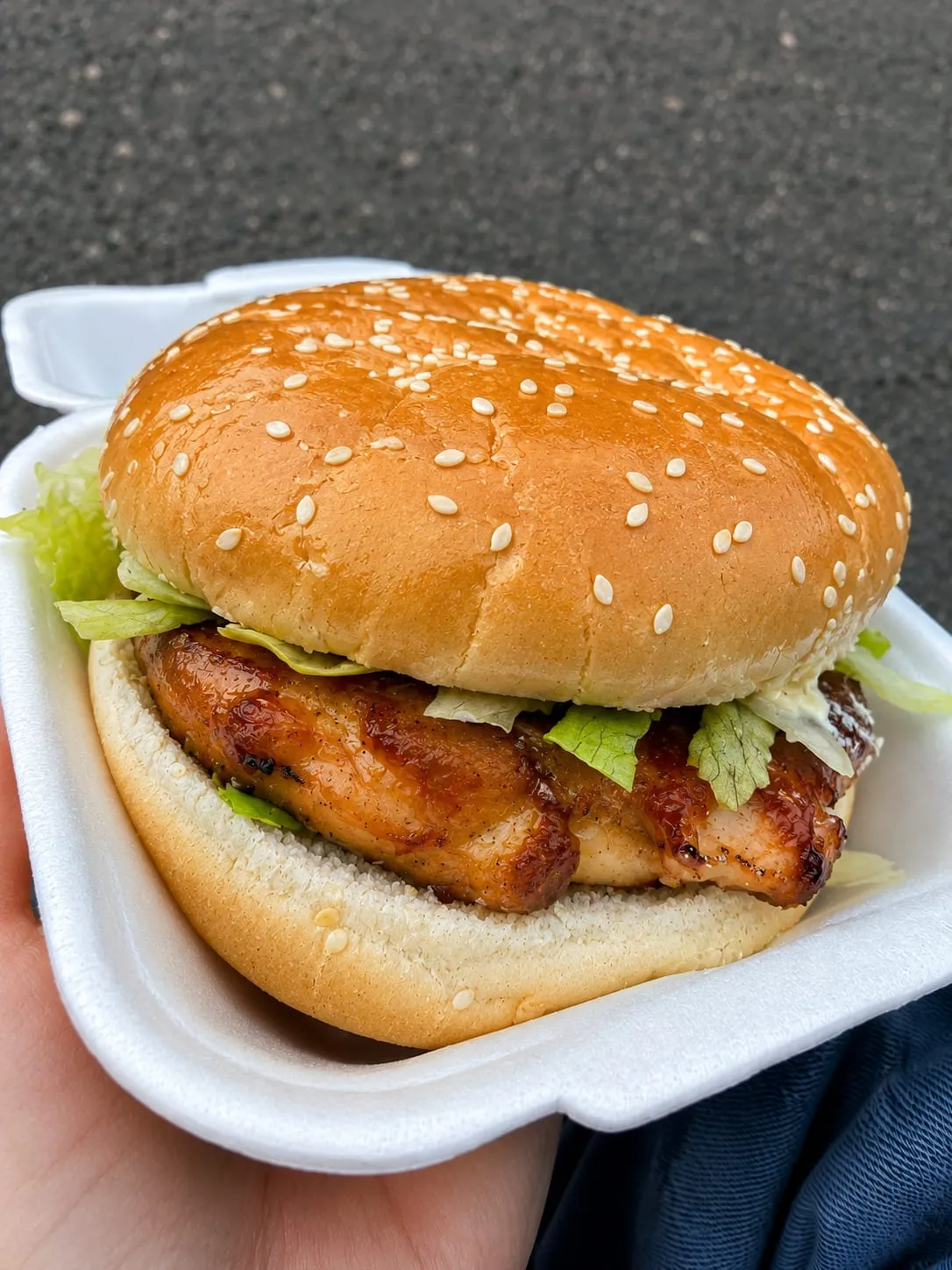 A chicken fillet burger in a soft sesame bun