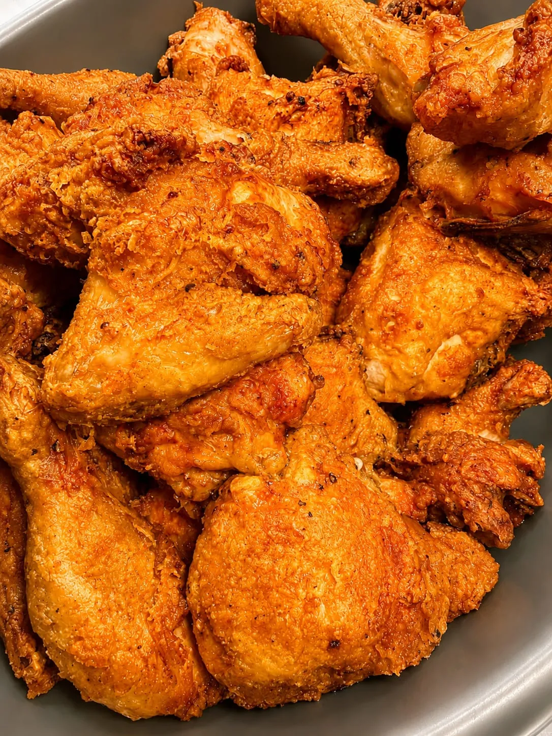 A close-up of golden fried chicken wings