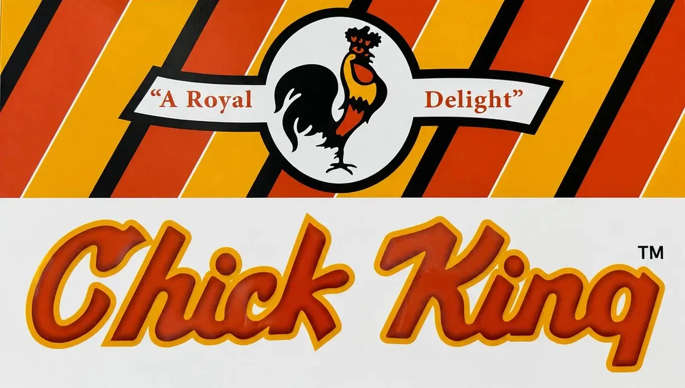 The Chick King shop sign: a rooster crest above the words A Royal Delight